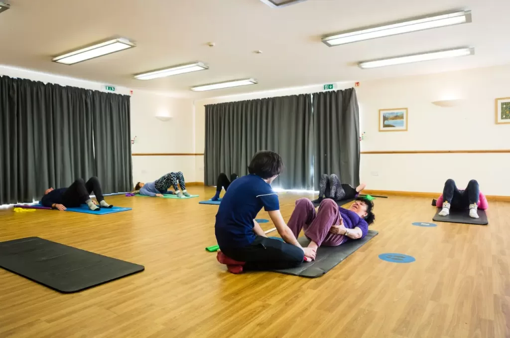 Indivdiual attention during a Pilates Class in Broadstone, Dorset