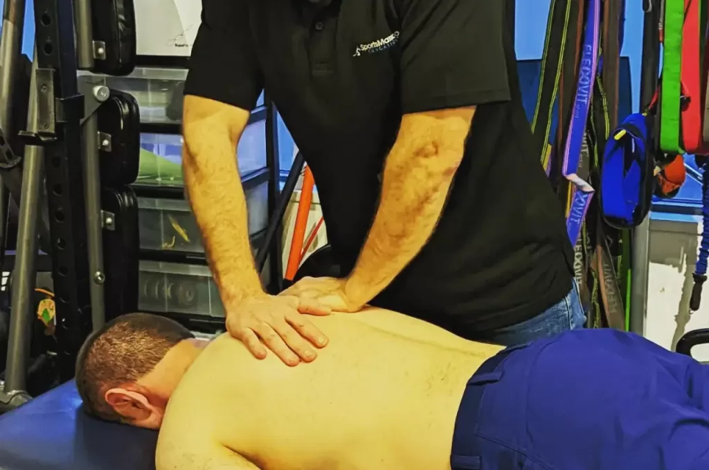 Student performing Sports Massage technique in a training session for Level 3 Sports Massage Course in Dorset