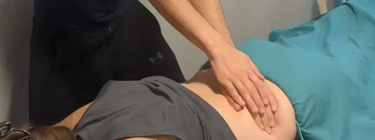 Sports massage therapist in Poole giving treatment to an athlete for recovery and injury prevention.